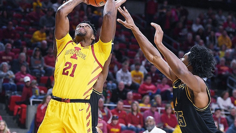Iowa State University Cyclones center Osun Osunniyi (21) takes a shot around North Carolina A&T Aggies forward Webster Filmore (25) during the first half at Hilton Coliseum Sunday, Nov. 13, 2022, in Ames, Iowa.  Photo by Nirmalendu Majumdar/Ames Tribune

Ncaa Men S Basketball