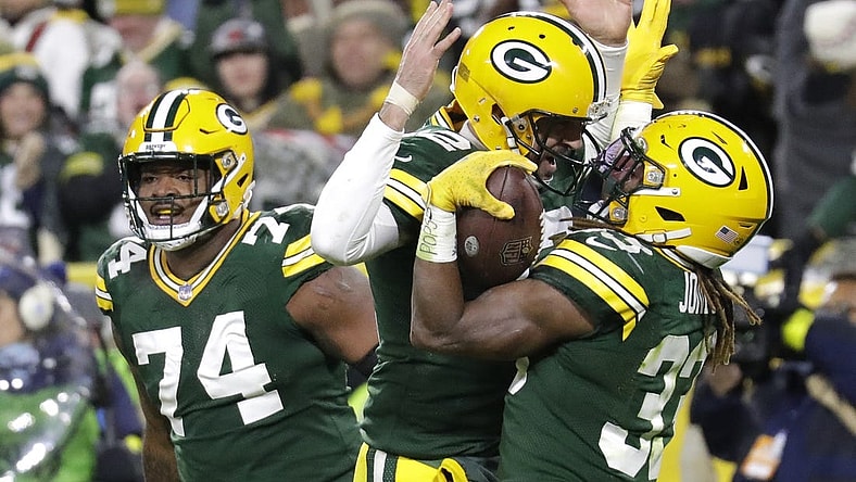 Nov 13, 2022; Green Bay, Wisconsin, USA; Green Bay Packers quarterback Aaron Rodgers (12) celebrates with Aaron Jones (33) after he scored a touchdown against the Dallas Cowboys at Lambeau Field. Mandatory Credit: Dan Powers/Appleton Post-Crescent-USA TODAY NETWORK