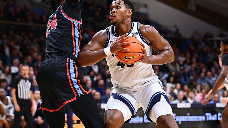Nov 14, 2022; Villanova, Pennsylvania, USA; Villanova Wildcats forward Eric Dixon (43) drives against Delaware State Hornets center Raymond Somerville (24) in the second half at William B. Finneran Pavilion. Mandatory Credit: Kyle Ross-USA TODAY Sports