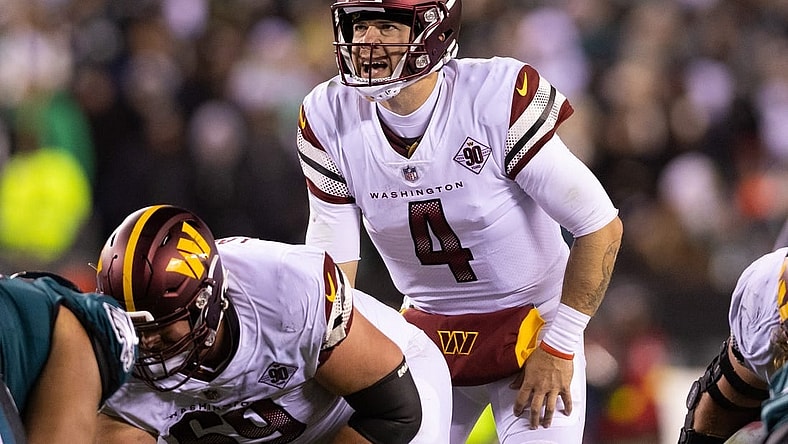Nov 14, 2022; Philadelphia, Pennsylvania, USA; Washington Commanders quarterback Taylor Heinicke (4) prepares to snap the ball during the third quarter against the Philadelphia Eagles at Lincoln Financial Field. Mandatory Credit: Bill Streicher-USA TODAY Sports