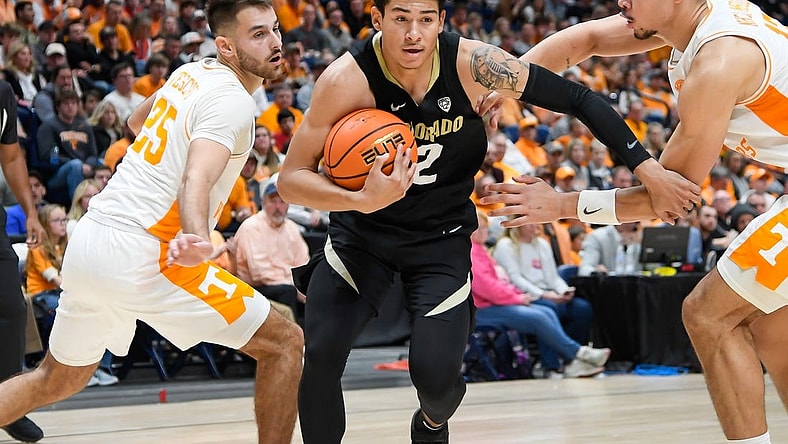 Nov 13, 2022; Nashville, Tennessee, USA;  Colorado Buffaloes guard KJ Simpson (2) and Tennessee Volunteers forward Olivier Nkamhoua (13) and guard Santiago Vescovi (25) during the second hall at Bridgestone Arena. Mandatory Credit: Steve Roberts-USA TODAY Sports