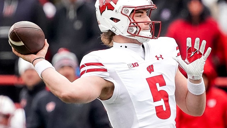 Nov 19, 2022; Lincoln, Nebraska, USA; Wisconsin Badgers quarterback Graham Mertz (5) throws a pass against the Nebraska Cornhuskers during the second quarter at Memorial Stadium. Mandatory Credit: Dylan Widger-USA TODAY Sports