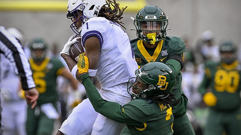Nov 19, 2022; Waco, Texas, USA; TCU Horned Frogs wide receiver Quentin Johnston (1) catches a pass for a first down against the Baylor Bears as cornerback Mark Milton (3) defends during the first quarter at McLane Stadium. Mandatory Credit: Jerome Miron-USA TODAY Sports
