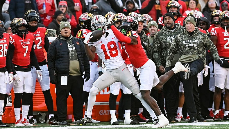 Nov 19, 2022; College Park, Maryland, USA;  Ohio State Buckeyes wide receiver Marvin Harrison Jr. (18) catches a pass as Maryland Terrapins defensive back Deonte Banks (3) defends during the first quarter at SECU Stadium. Mandatory Credit: Tommy Gilligan-USA TODAY Sports