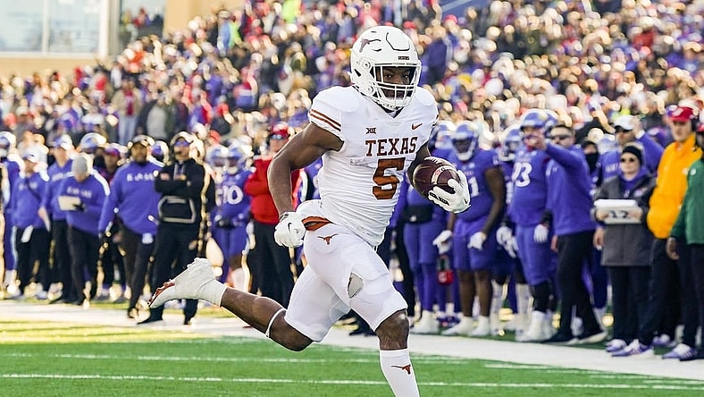 Nov 19, 2022; Lawrence, Kansas, USA; Texas Longhorns running back Bijan Robinson (5) runs for a touchdown during the first half against the Kansas Jayhawks at David Booth Kansas Memorial Stadium. Mandatory Credit: Jay Biggerstaff-USA TODAY Sports