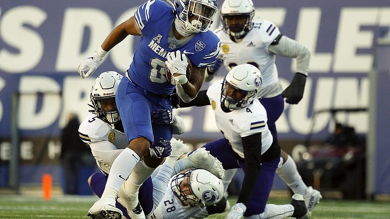 Nov 19, 2022; Memphis, Tennessee, USA; Memphis Tigers running back Jevyon Ducker (8) runs the ball during the second half against the North Alabama Lions at Simmons Bank Liberty Stadium. Mandatory Credit: Petre Thomas-USA TODAY Sports