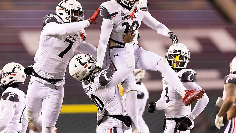 Nov 19, 2022; Philadelphia, Pennsylvania, USA; Cincinnati Bearcats safety Jacob Dingle (29) celebrates with teammates after intercepting a pass against the Temple Owls during the second quarter at Lincoln Financial Field. Mandatory Credit: Bill Streicher-USA TODAY Sports