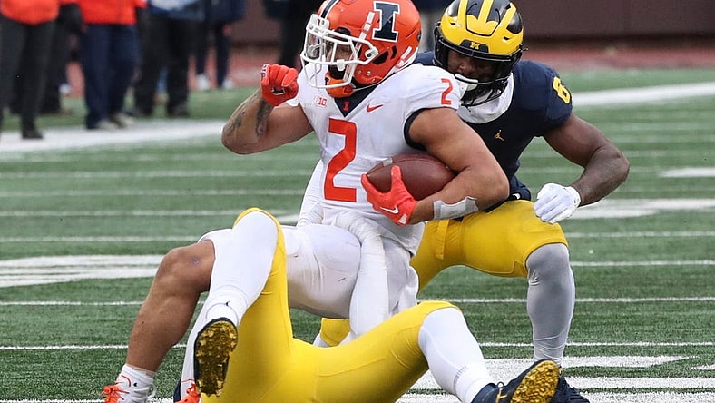 Michigan Wolverines defensive back Rod Moore (bottom) tackles Illinois Fighting Illini running back Chase Brown (2) during the second half Nov. 19, 2022 at Michigan Stadium.
Michill 111922 Kd 3896