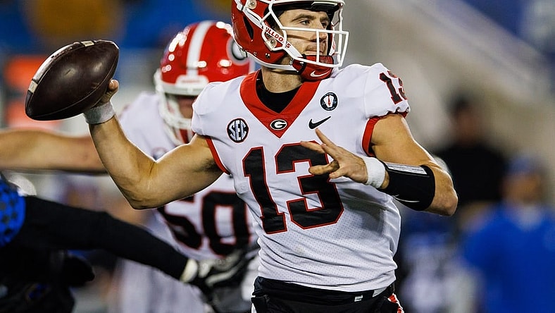 Nov 19, 2022; Lexington, Kentucky, USA; Georgia Bulldogs quarterback Stetson Bennett (13) passes the ball against the Kentucky Wildcats during the third quarter at Kroger Field. Mandatory Credit: Jordan Prather-USA TODAY Sports