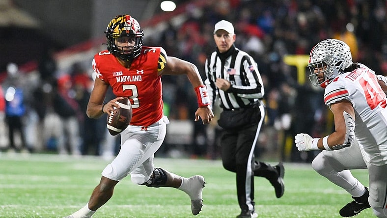 Nov 19, 2022; College Park, Maryland, USA; Maryland Terrapins quarterback Taulia Tagovailoa (3) run by Ohio State Buckeyes defensive end J.T. Tuimoloau (44) during the second half at SECU Stadium. Mandatory Credit: Tommy Gilligan-USA TODAY Sports