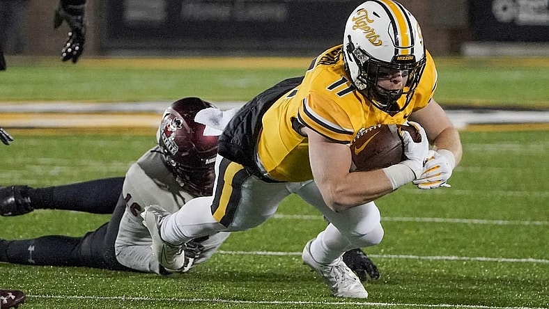 Nov 19, 2022; Columbia, Missouri, USA; Missouri Tigers wide receiver Barrett Banister (11) runs the ball against New Mexico State Aggies defensive lineman Donavan King (16) during the first half at Faurot Field at Memorial Stadium. Mandatory Credit: Denny Medley-USA TODAY Sports