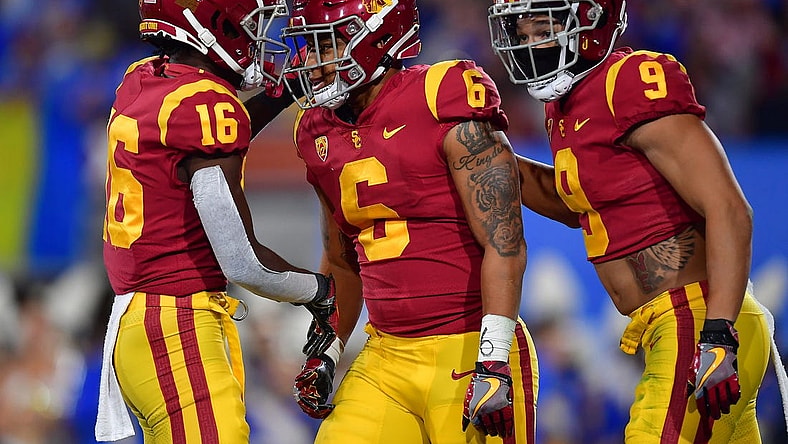 Nov 19, 2022; Pasadena, California, USA; Southern California Trojans running back Austin Jones (6) celebrates his touchdown scored against the UCLA Bruins with wide receiver Tahj Washington (16) and wide receiver Michael Jackson III (9) during the first half at the Rose Bowl. Mandatory Credit: Gary A. Vasquez-USA TODAY Sports