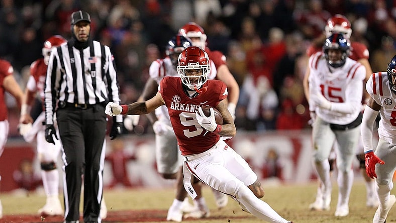Nov 19, 2022; Fayetteville, Arkansas, USA; Arkansas Razorbacks wide receiver Jadon Haselwood (9) runs after a catch in the second quarter against the Ole Miss Rebels at Donald W. Reynolds Razorback Stadium. Mandatory Credit: Nelson Chenault-USA TODAY Sports