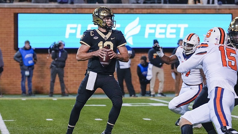 Nov 19, 2022; Winston-Salem, North Carolina, USA; Wake Forest Demon Deacons quarterback Sam Hartman (10) drops back to pass against the Syracuse Orange during the first half at Truist Field. Mandatory Credit: Jim Dedmon-USA TODAY Sports