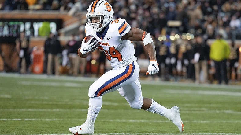 Nov 19, 2022; Winston-Salem, North Carolina, USA;  Syracuse Orange running back Sean Tucker (34) runs around end towards the end zone against the Wake Forest Demon Deacons during the first half at Truist Field. Mandatory Credit: Jim Dedmon-USA TODAY Sports