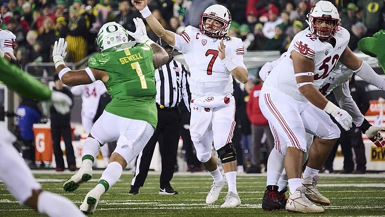 Nov 19, 2022; Eugene, Oregon, USA; Utah Utes quarterback Cameron Rising (7) throws a pass during the first half against Oregon Ducks linebacker Noah Sewell (1) at Autzen Stadium. Mandatory Credit: Troy Wayrynen-USA TODAY Sports