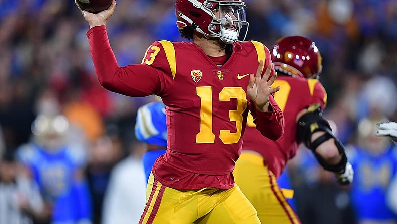Nov 19, 2022; Pasadena, California, USA; Southern California Trojans quarterback Caleb Williams (13) throws against the UCLA Bruins during the first half at the Rose Bowl. Mandatory Credit: Gary A. Vasquez-USA TODAY Sports
