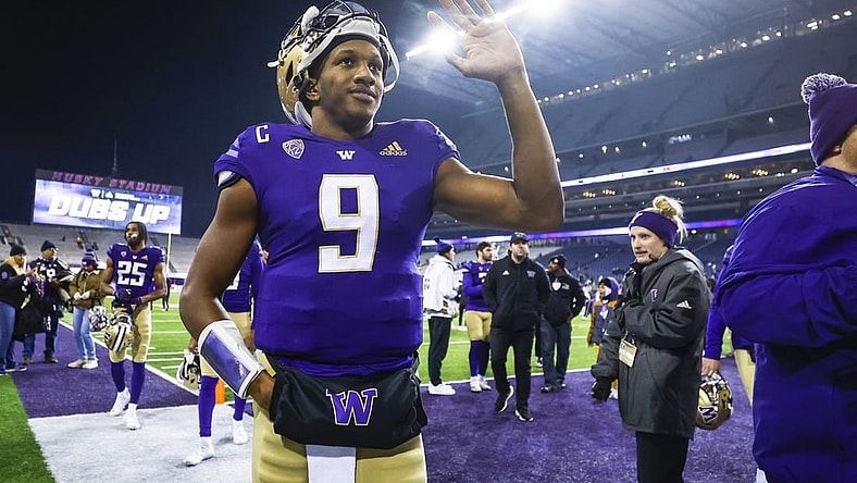 Nov 19, 2022; Seattle, Washington, USA; Washington Huskies quarterback Michael Penix Jr. (9) waves to fans while walking to the locker room following a 54-7 victory against the Colorado Buffaloes at Alaska Airlines Field at Husky Stadium. Mandatory Credit: Joe Nicholson-USA TODAY Sports