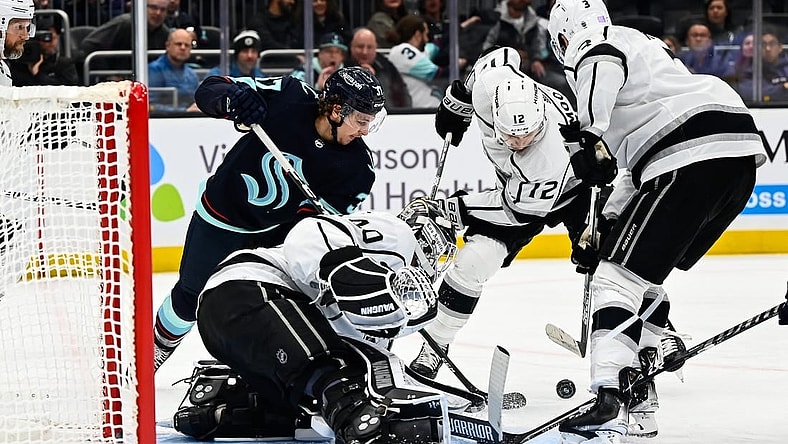 Nov 19, 2022; Seattle, Washington, USA; Los Angeles Kings goaltender Cal Petersen (40) defends the goal as Seattle Kraken center Jaden Schwartz (17) and Los Angeles Kings left wing Trevor Moore (12) fight for the puck during the third period at Climate Pledge Arena.  Seattle won 3-2. Mandatory Credit: Steven Bisig-USA TODAY Sports