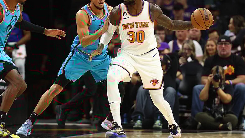 Nov 20, 2022; Phoenix, Arizona, USA; Phoenix Suns guard Devin Booker (1) defends against New York Knicks forward Julius Randle (30) in the first half at Footprint Center. Mandatory Credit: Mark J. Rebilas-USA TODAY Sports