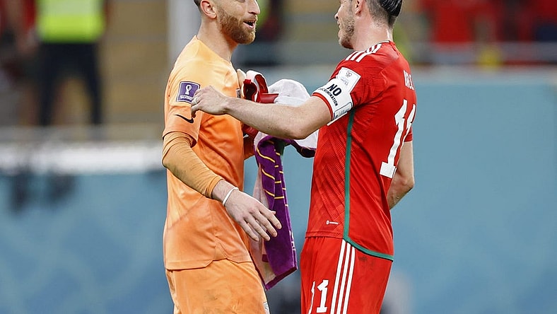 Nov 21, 2022; Al Rayyan, Qatar; United States of America goalkeeper Matt Turner (1) talks with Wales forward Gareth Bale (11) after a group stage match during the 2022 FIFA World Cup at Ahmed Bin Ali Stadium. Mandatory Credit: Yukihito Taguchi-USA TODAY Sports