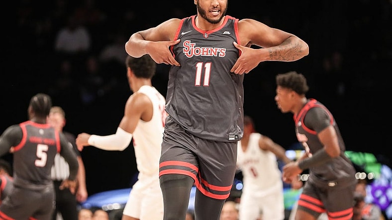Nov 21, 2022; Brooklyn, New York, USA;  St. John's Red Storm center Joel Soriano (11) celebrates after scoring in the first half against the Temple Owls at Barclays Center. Mandatory Credit: Wendell Cruz-USA TODAY Sports