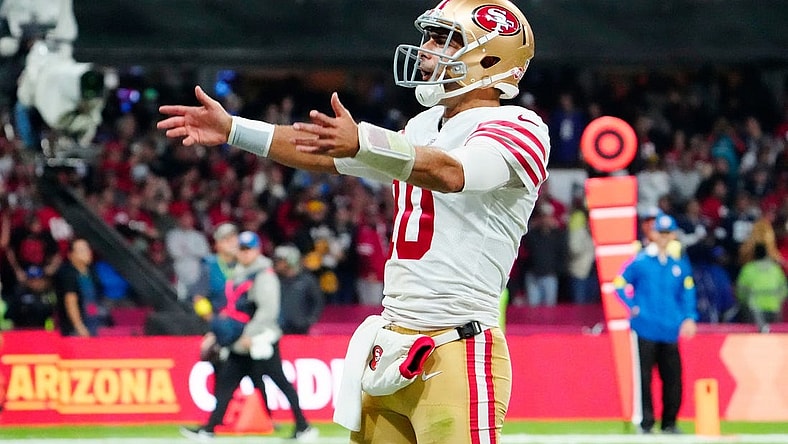 Nov 21, 2022; Mexico City, MEX; San Francisco 49ers quarterback Jimmy Garoppolo (10) celebrates after his touchdown pass against the Arizona Cardinals during the second half at Estadio Azteca. Mandatory Credit: Rob Schumacher-USA TODAY Sports