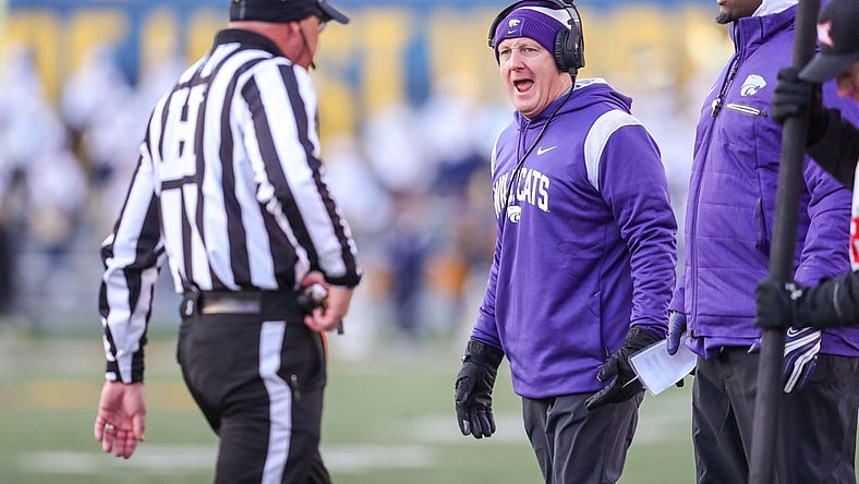 Nov 19, 2022; Morgantown, West Virginia, USA; Kansas State Wildcats head coach Chris Klieman talks to an official along the sidelines during the third quarter against the West Virginia Mountaineers at Mountaineer Field at Milan Puskar Stadium. Mandatory Credit: Ben Queen-USA TODAY Sports