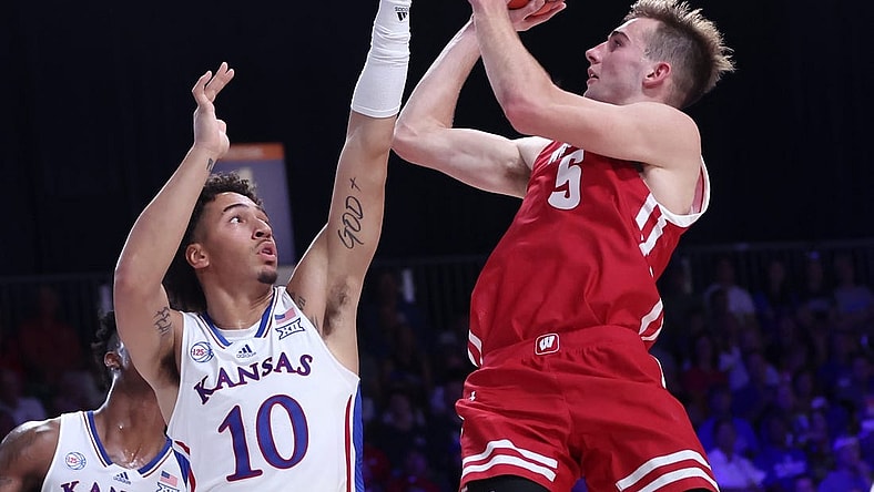 Nov 24, 2022; Paradise Island, BAHAMAS; Wisconsin Badgers forward Tyler Wahl (5) shoots over Kansas Jayhawks forward Jalen Wilson (10) during the second half at Imperial Arena. Mandatory Credit: Kevin Jairaj-USA TODAY Sports