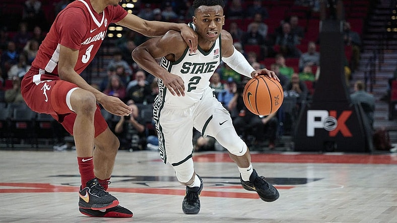Nov 24, 2022; Portland, Oregon, USA;  Michigan State Spartans guard Tyson Walker (2) drives to the basket during the first half against Alabama Crimson Tide guard Rylan Griffen (3) at Moda Center. Mandatory Credit: Troy Wayrynen-USA TODAY Sports