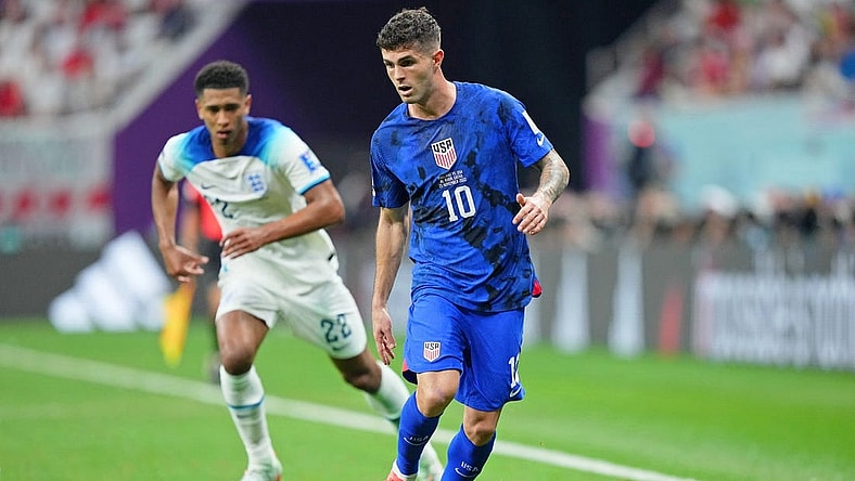 Nov 25, 2022; Al Khor, Qatar; United States of America forward Christian Pulisic (10) dribbles the ball against England during the second half of a group stage match during the 2022 World Cup at Al Bayt Stadium. Mandatory Credit: Danielle Parhizkaran-USA TODAY Sports