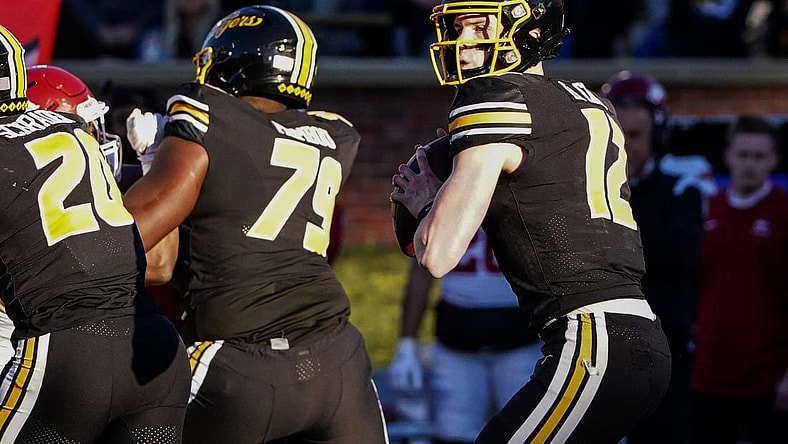 Nov 25, 2022; Columbia, Missouri, USA; Missouri Tigers quarterback Brady Cook (12) drops to throw against the Arkansas Razorbacks during the first half at Faurot Field at Memorial Stadium. Mandatory Credit: Denny Medley-USA TODAY Sports
