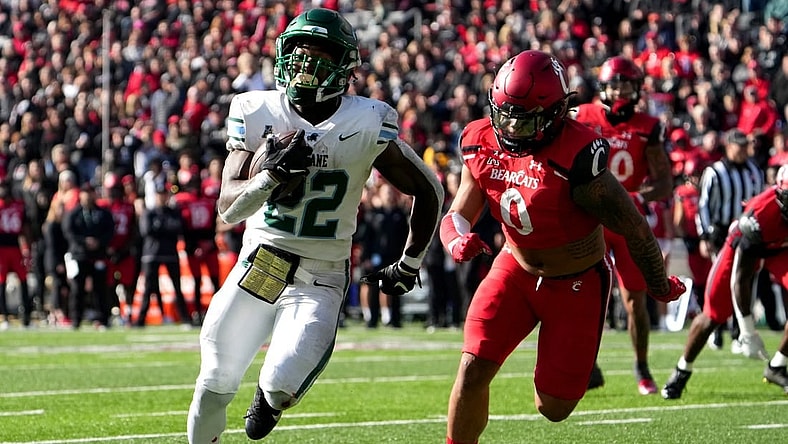 Tulane Green Wave running back Tyjae Spears (22)  beats Cincinnati Bearcats linebacker Ivan Pace Jr. (0) on a touchdown run in the second quarter during a college football game, Friday, Nov. 25, 2022, at Nippert Stadium in Cincinnati.

Ncaaf Tulane Green Wave At Cincinnati Bearcats Nov 25 0162