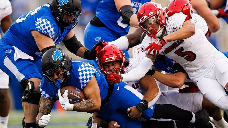 Nov 26, 2022; Lexington, Kentucky, USA; Kentucky Wildcats running back Chris Rodriguez Jr. (24) falls forward on a run during the first quarter against the Louisville Cardinals at Kroger Field. Mandatory Credit: Jordan Prather-USA TODAY Sports
