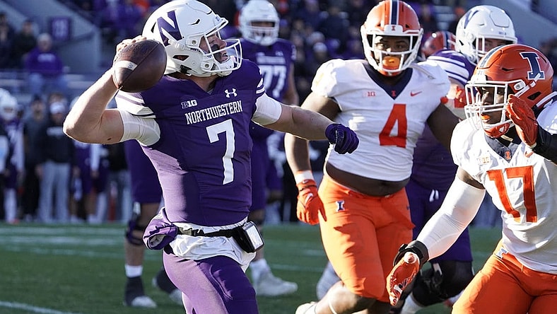 Nov 26, 2022; Evanston, Illinois, USA; Northwestern Wildcats quarterback Cole Freeman (7) looks to pass against the Illinois Fighting Illini during the first half at Ryan Field. Mandatory Credit: David Banks-USA TODAY Sports