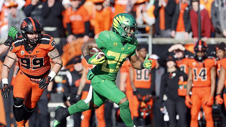 Nov 26, 2022; Corvallis, Oregon, USA; Oregon Ducks running back Jordan James (20) runs with the ball during the first half against the Oregon State Beavers at Reser Stadium. Mandatory Credit: Soobum Im-USA TODAY Sports