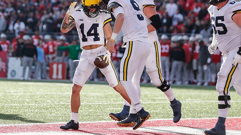 Michigan quarterback J.J. McCarthy (9) celebrates his touchdown against Ohio State with wide receiver Roman Wilson (14) during the second half at Ohio Stadium in Columbus, Ohio, on Saturday, Nov. 26, 2022.