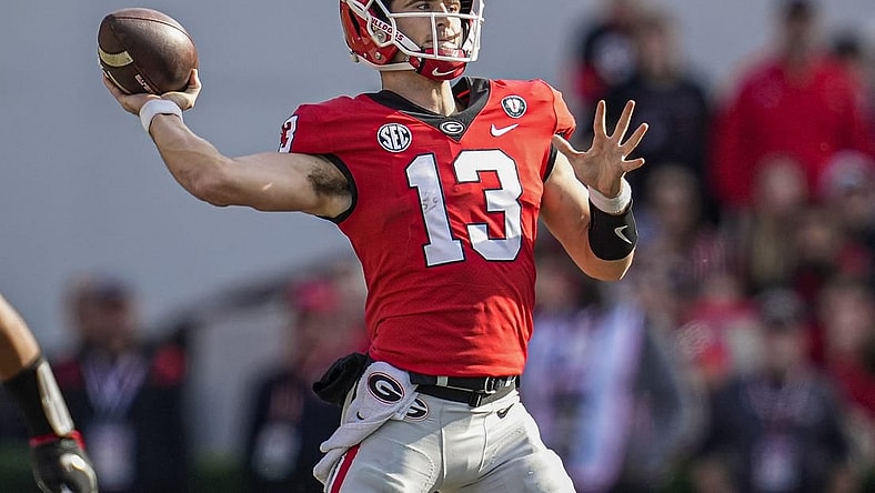 Nov 26, 2022; Athens, Georgia, USA; Georgia Bulldogs quarterback Stetson Bennett (13) passes the ball against the Georgia Tech Yellow Jackets during the first half at Sanford Stadium. Mandatory Credit: Dale Zanine-USA TODAY Sports