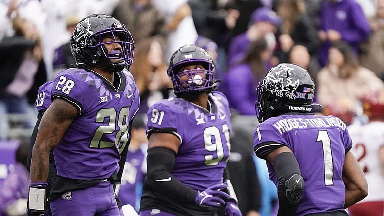 Nov 26, 2022; Fort Worth, Texas, USA; ]TCU Horned Frogs safety Millard Bradford (28) celebrates his 36-yard interception returned for a touchdown against the Iowa State Cyclones during the first half at Amon G. Carter Stadium. Mandatory Credit: Raymond Carlin III-USA TODAY Sports