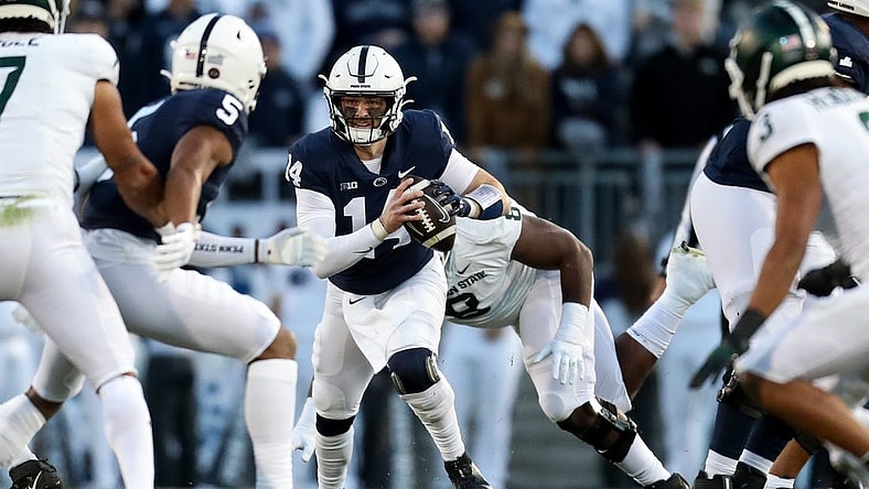 Nov 26, 2022; University Park, Pennsylvania, USA; Penn State Nittany Lions quarterback Sean Clifford (14) runs with the ball during the first quarter against the Michigan State Spartans at Beaver Stadium. Mandatory Credit: Matthew OHaren-USA TODAY Sports