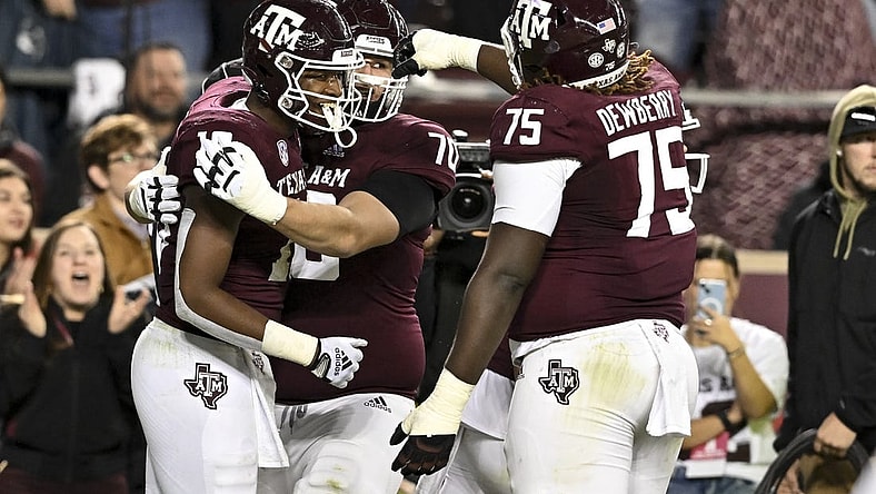 Nov 26, 2022; College Station, Texas, USA;  Texas A&M Aggies tight end Donovan Green (18) celebrates his touchdown during the second quarter against the LSU Tigers at Kyle Field. Mandatory Credit: Maria Lysaker-USA TODAY Sports