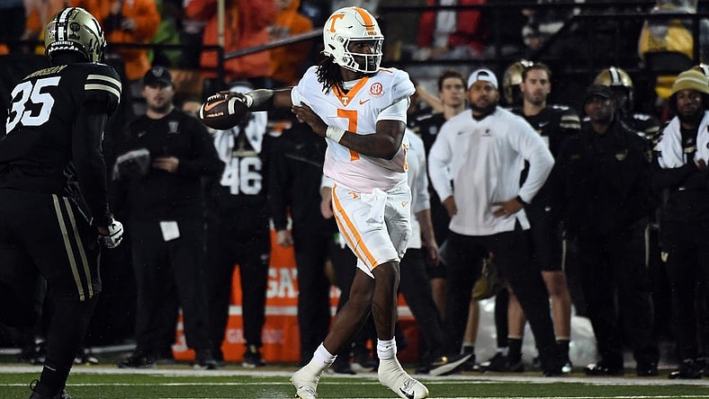 Nov 26, 2022; Nashville, Tennessee, USA; Tennessee Volunteers quarterback Joe Milton III (7) rolls out to pass against the Vanderbilt Commodores during the first half at FirstBank Stadium. Mandatory Credit: Christopher Hanewinckel-USA TODAY Sports