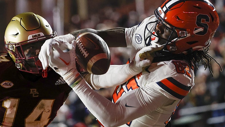 Nov 26, 2022; Chestnut Hill, Massachusetts, USA; Boston College Eagles cornerback Jalon Williams (14) breaks up a pass intended for Syracuse Orange wide receiver Damien Alford (82) during the second quarter at Alumni Stadium. Mandatory Credit: Winslow Townson-USA TODAY Sports