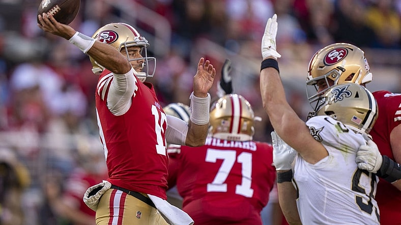 November 27, 2022; Santa Clara, California, USA; San Francisco 49ers quarterback Jimmy Garoppolo (10) passes the football against the New Orleans Saints during the second quarter at Levi's Stadium. Mandatory Credit: Kyle Terada-USA TODAY Sports