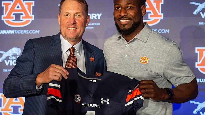 Auburn Tigers football coach Hugh Freeze poses with associate head coach Cadillac Williams at the Woltosz Football Performance Center in Auburn, Ala., on Tuesday, Nov. 29, 2022