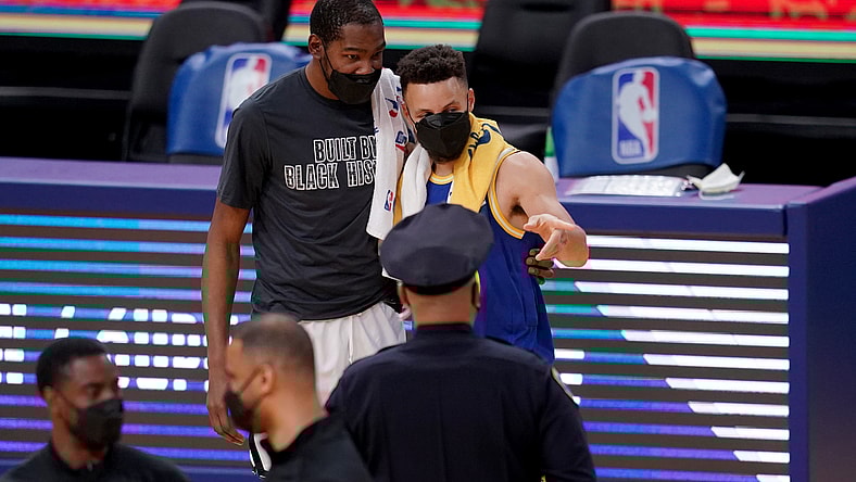 Golden State Warriors' Kevin Durant and Stephen Curry