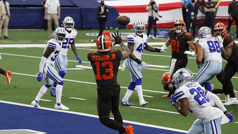 Oct 4, 2020; Arlington, Texas, USA; Cleveland Browns wide receiver Odell Beckham Jr. (13) catches a touchdown pass against Dallas Cowboys cornerback Daryl Worley (28) in the second quarter at AT&T Stadium. Mandatory Credit: Tim Heitman-USA TODAY Sports