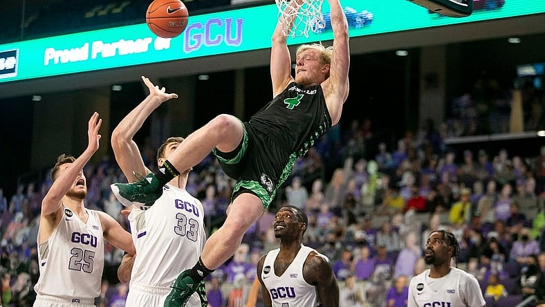 March 5, 2021; Phoenix, AZ, USA; Utah Valley's guard Trey Woodbury (4) dunks the ball at Grand Canyon University Arena on March 5, 2021. Credit: Meg Potter/The Arizona Republic

Grand Canyon University