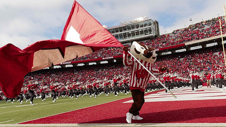 Oct 30, 2021; Madison, Wisconsin, USA;  Wisconsin Badgers mascot Bucky Badger waves the Wisconsin flag prior to the game against the Iowa Hawkeyes at Camp Randall Stadium. Mandatory Credit: Jeff Hanisch-USA TODAY Sports