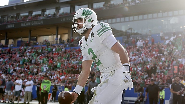 Dec 23, 2021; Frisco, TX, USA; North Texas Mean Green quarterback Austin Aune (2) celebrates a touchdown in the second quarter against the Miami (Oh) Redhawks at Toyota Stadium. Mandatory Credit: Tim Heitman-USA TODAY Sports